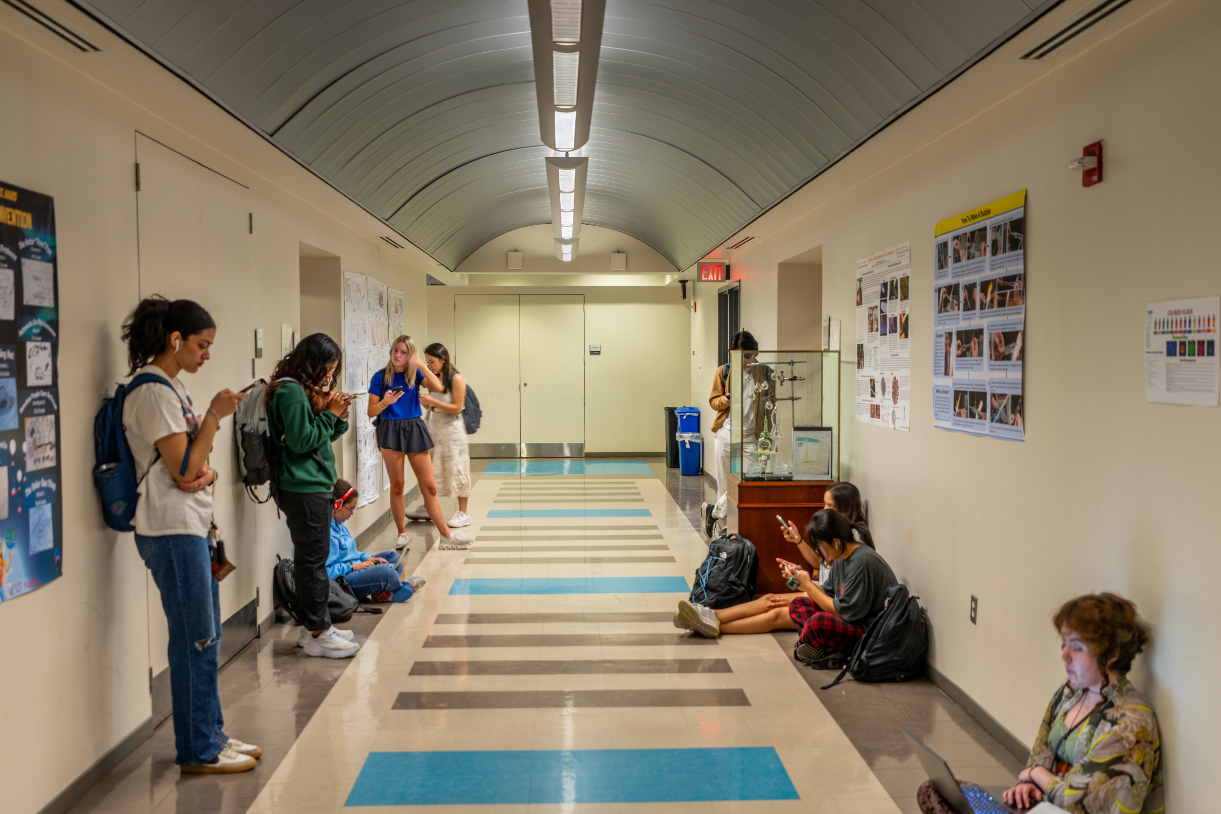 Students wait in a hallway